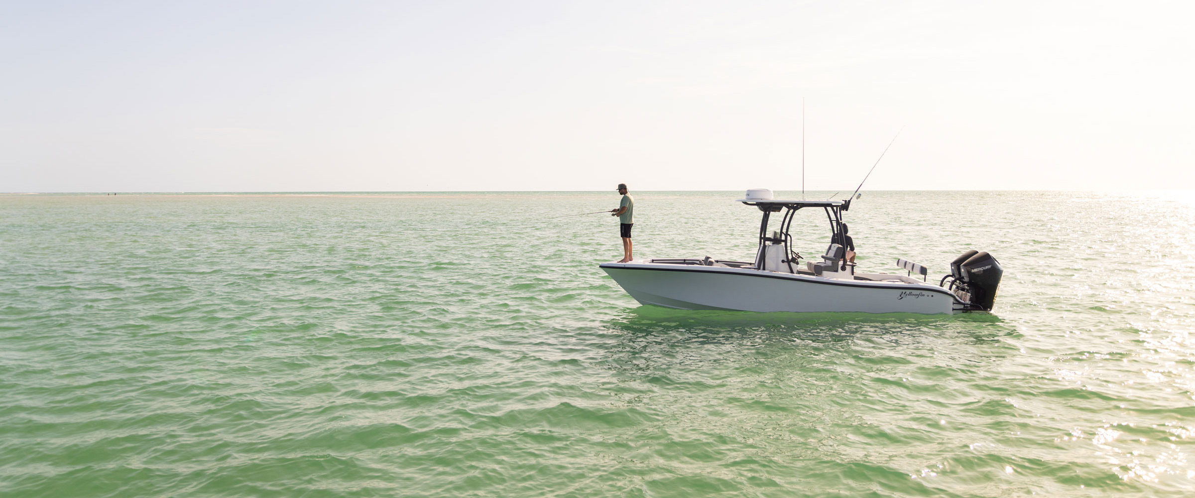 A fisherman on his Yellowfin 26 Hybrid Center Console Boat