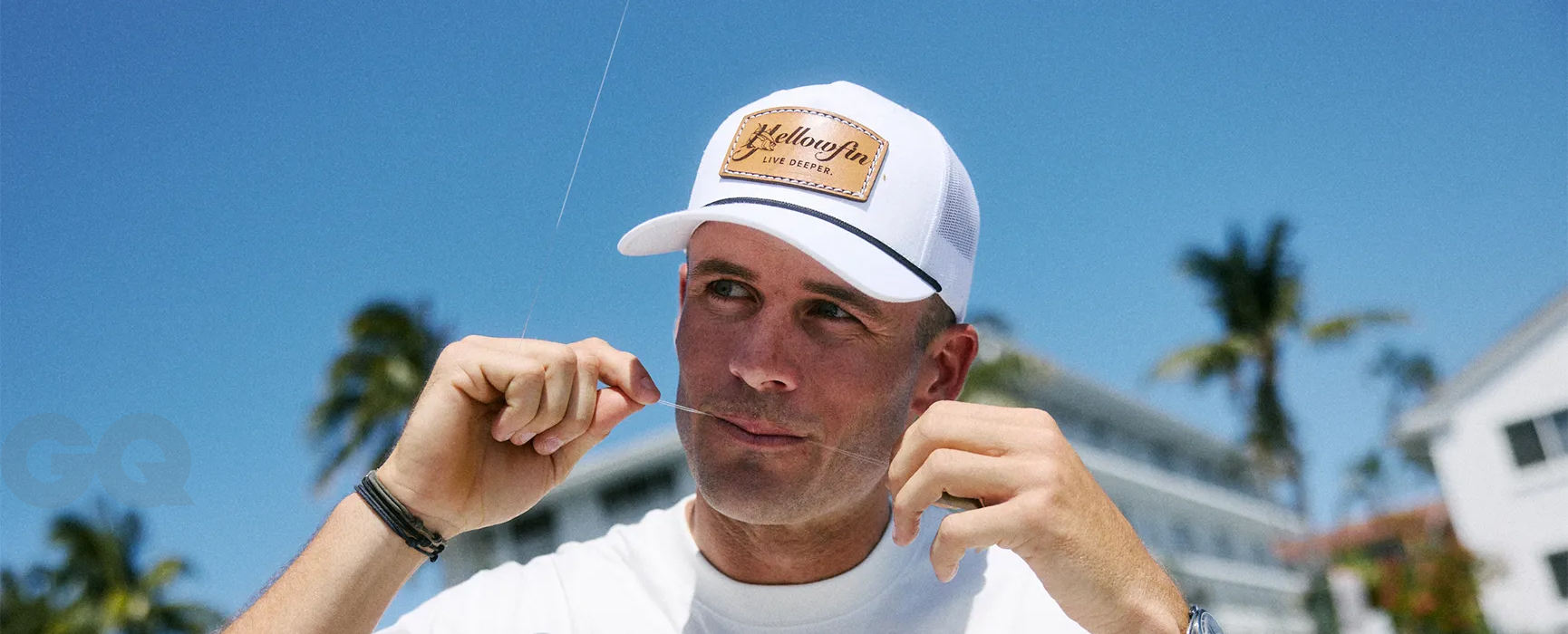 Tommy Paul wearing a Yellowfin Live Deeper hat