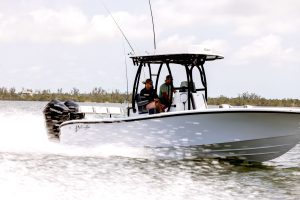Two men driving the 26 Hybrid Boat by Yellowfin