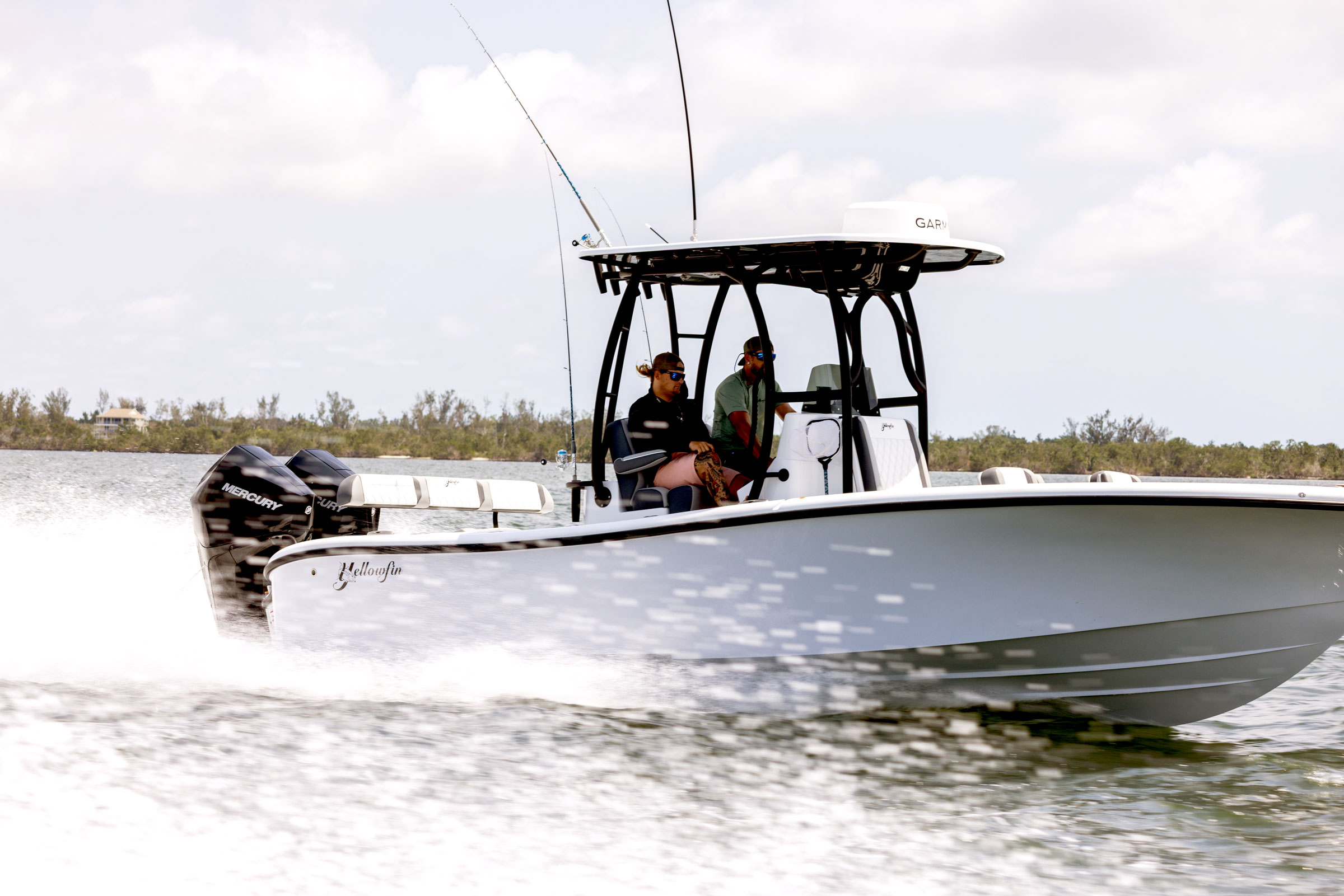 Two men driving the 26 Hybrid Boat by Yellowfin