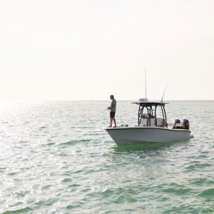 A fisherman on the Yellowfin 26 Hybrid Bay Boat