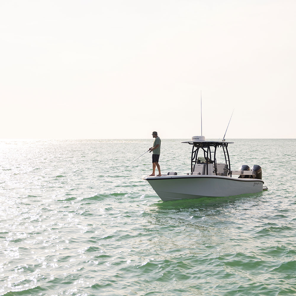 A fisherman on the Yellowfin 26 Hybrid Bay Boat